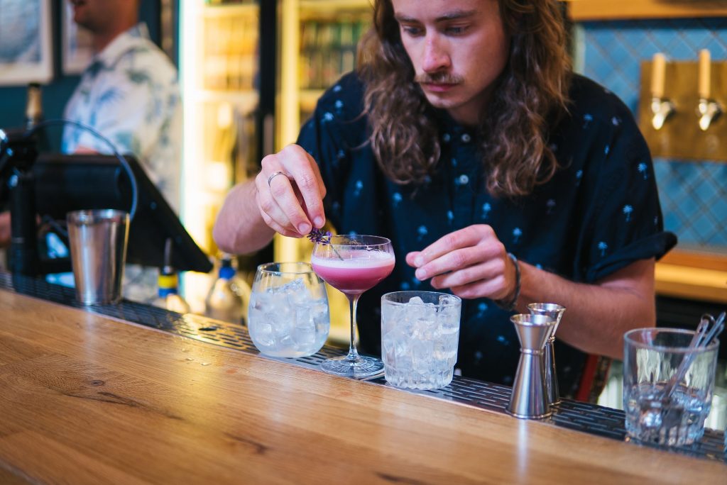 a bartender mixing a yonder cocktail